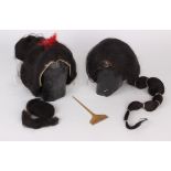 A pair of early 20th Century Japanese real hair Geisha wigs, each wig has a moulded papier-mâché