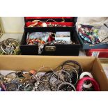 A quantity of costume jewellery to include brooches, necklaces and bracelets