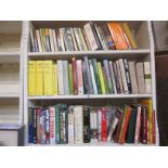 Six shelves of sport and miscellaneous books