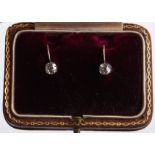 A pair of gold and diamond earrings, the diamonds 4mm in diameter approx. (gold unmarked) in