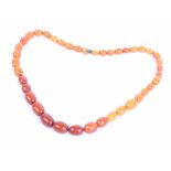 A graduated 'butterscotch' amber beaded necklace, 44.6g in total