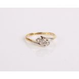 An 18ct gold, platinum and diamond three stone ring, 2.4g in total