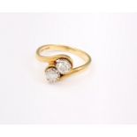 An 18ct gold and diamond two stone ring, each diamond 4mm in diameter approx. 3.9g in total