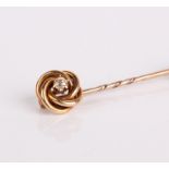 A gold and diamond hat pin, with metal clasp 4.7g in total