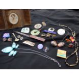 Assorted costume jewellery to include clip on earrings, 20th Century brooches and a miniature