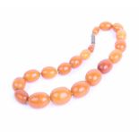 A graduated 'butterscotch' amber beaded necklace, 47.2g in total 39.5cm long in total