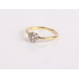 An 18ct gold and diamond flower shaped ring, 1.8g in total