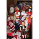 Three boxes of assorted dolls and souvenir dolls