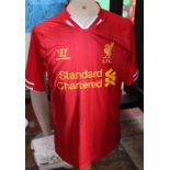 Liverpool replica football shirt signed by Luis Suarez