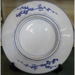 A Chinese blue and white charger, decorated with carp, 32cm in diameter