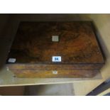 A 19th Century Walnut writing box, inset with mother of pearl, enclosing red velvet writing slope,