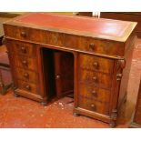 A Victorian walnut kneehole desk with inset writing surface, nine drawers and a cupboard 80cm