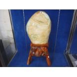 A large rough Jade boulder, on stand, 42cm high not including stand