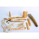 Assorted ivory and bone items, to include counters, shoe horn and beaded necklaces