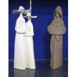 Lladro figure of a monk, 33cm high and a Lladro figure group of two nuns, 33cm high (2)
