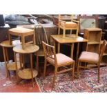 A pair of oak two tier lamp tables, drop leaf table, two oak bookcases, mirror and three chairs