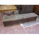 An oak and pine panelled chest 202cm length