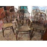 A set of eight wheelback windsor chairs including two armchairs together with a 19th Century