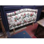 An upholstered double headboard