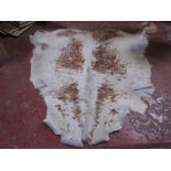 An animal skin rug approx 160 x 320cm