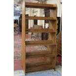 A pair of modern open pine bookcases each 198cm high, 93cm wide