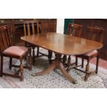 A Regency style tilt top mahogany dining table 65cm high, 139cm length on pedestal base and a