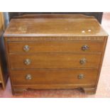 A 19th Century mahogany chest with two short and three long drawers, a triple mirror and an oak