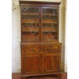 A George III mahogany secretaire bookcase the dentil cornice enclosing a pair of astragal glazed