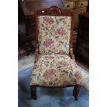 An Edwardian mahogany and tapestry upholstered chair