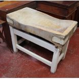 A butchers block on painted stand