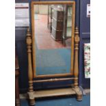 A Victorian oak cheval mirror with turned supports 158cm high, 85cm wide