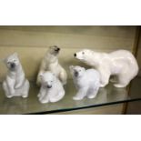 Three Lladro model polar bears, a Branscombe example and another (5)