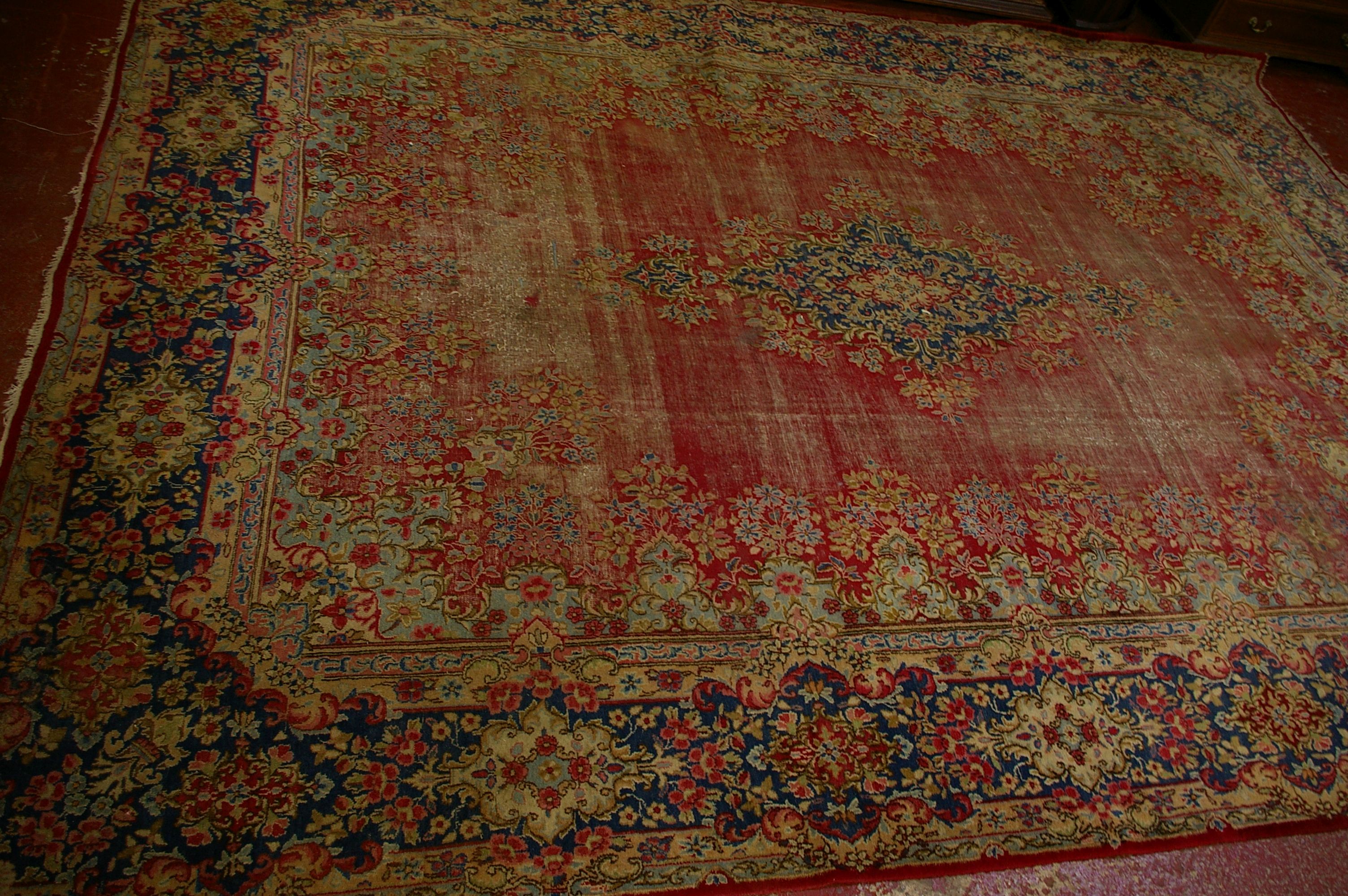 A Sarouk carpet worn 420 x 320cm