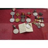 A mixed lot of collectable items to include a south Africa medal, binoculars, badges, typewriter and