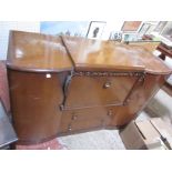 A 1930's oak sideboard two oak chests, a writing table and an Edwardian corner chair