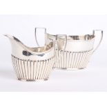 Silver: A late Victorian silver sugar bowl and milk jug, J Sherwood and Sons Birmingham 1897. 12.8