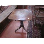 A 19th Century mahogany tilt top occasional table on ring turned column and tripod legs 74cm high,