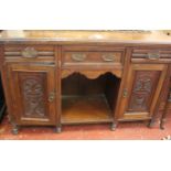 A late Victorian sideboard with three drawers and two cupboards below 97cm high, 153cm wide