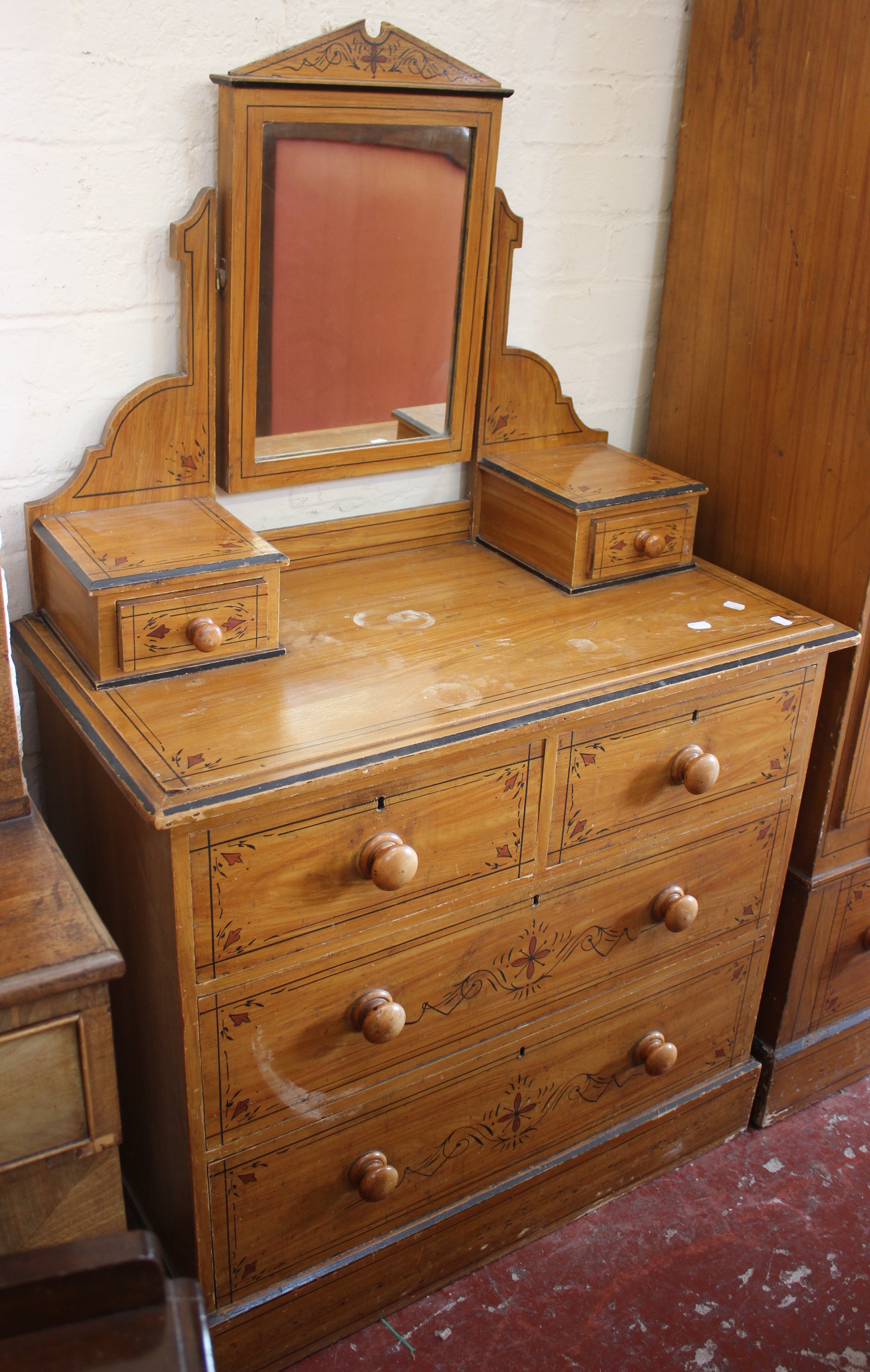 A Victorian painted bedroom suite to include a wardrobe and a mirror back dressing table, together
