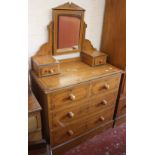 A Victorian painted bedroom suite to include a wardrobe and a mirror back dressing table, together