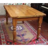 A modern pine kitchen table 152cm length