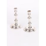 Silver: A pair of Mappin & Webb silver candlesticks London 1969, 17 cm tall.