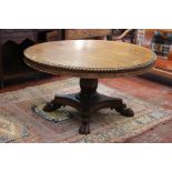 A Regency rosewood breakfast table the circular top with a gadroon edge, on facetted baluster