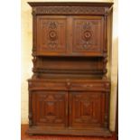A Victorian oak cupboard with superstructure and drawers and cupboards below, 138cm wide