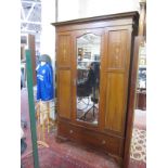 An Edwardian mahogany and inlaid wardrobe with central mirrored door, 202cm high, 132cm wide and a