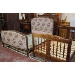 A French provincial fruitwood bed with carved frame and another French beech framed bed