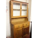 A pine two two part glazed dresser 190cm high, 107cm wide