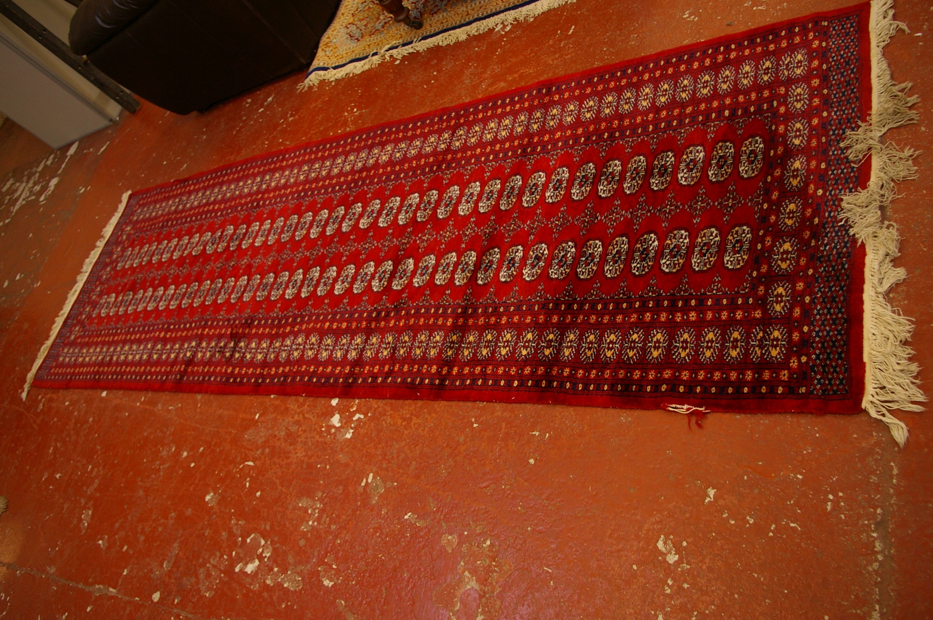 A Pakistan Bokhara carpet 310 x 100cm