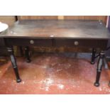 A Victorian ebonised desk with two frieze drawers pierced frieze on tight ring turned legs 135cm