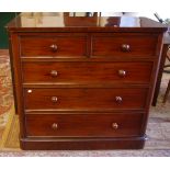 A 19th Century mahogany chest with two short and three long graduated drawers bearing plaque '